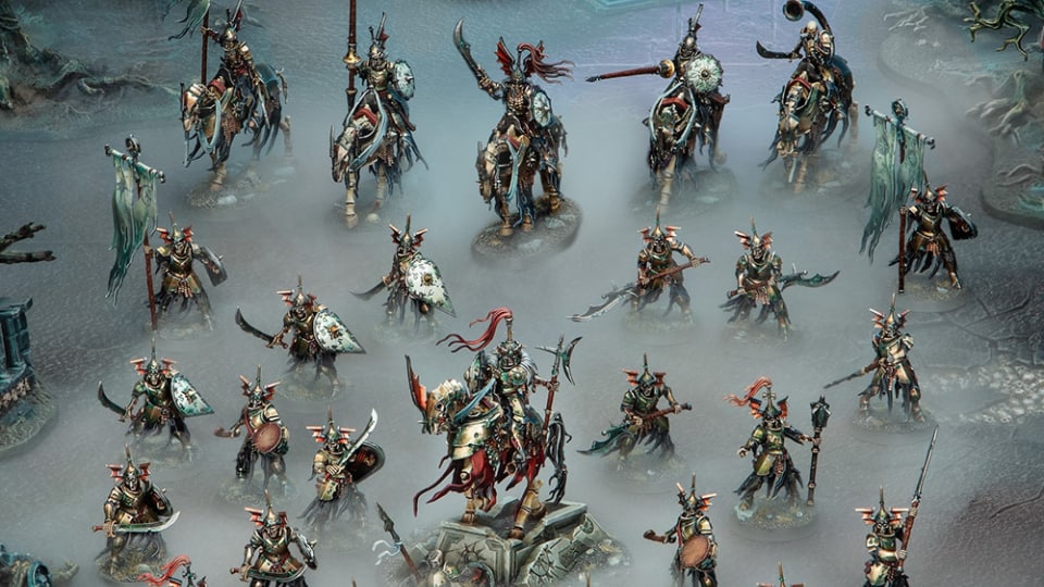 A collection of skeletal warriors standing in a fog-covered battlefield.
