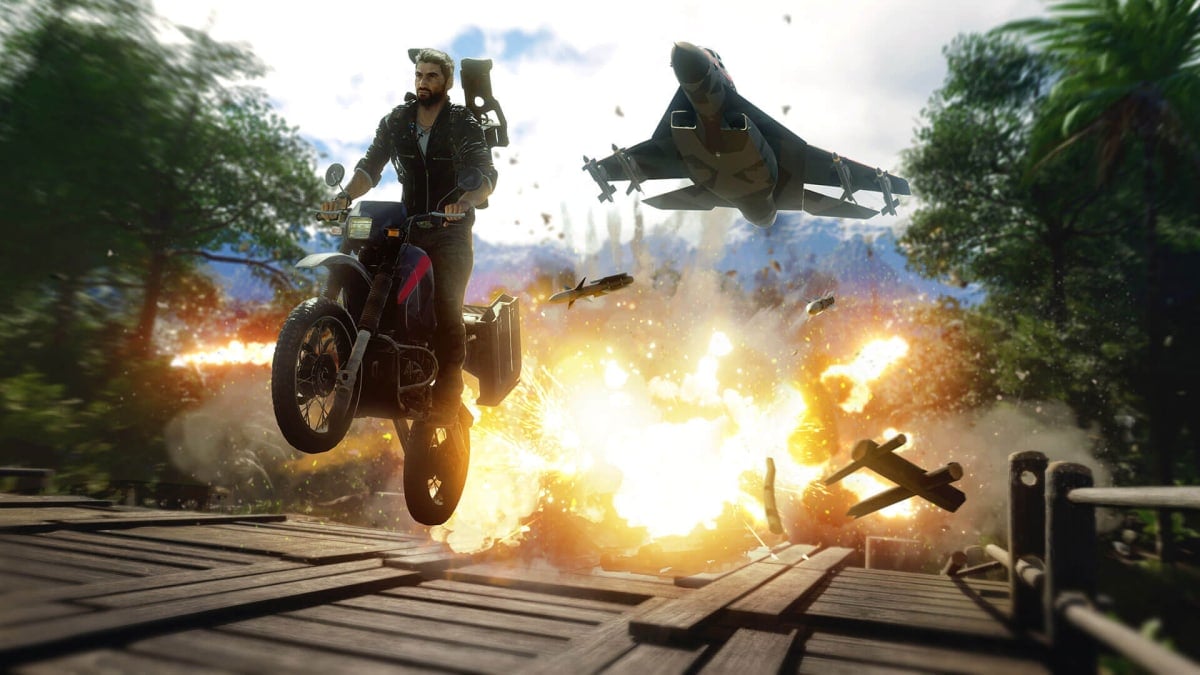 Rico leaping over an exploding bridge in Just Cause 4, an Avalanche Studios game