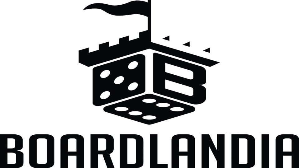 A logo of a die made to look like a castle tower. The name "Boardlandia" is below it in black text on a white background.