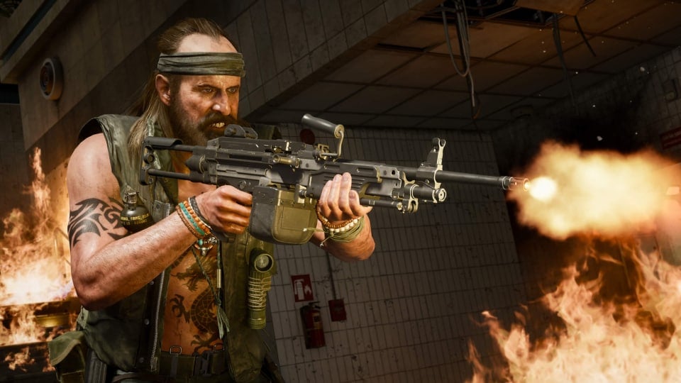 A man with long hair and a bandana firing a gun in Call of Duty
