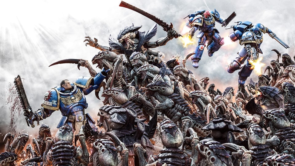 Three Space Marines fighting off a horde of alien monsters.