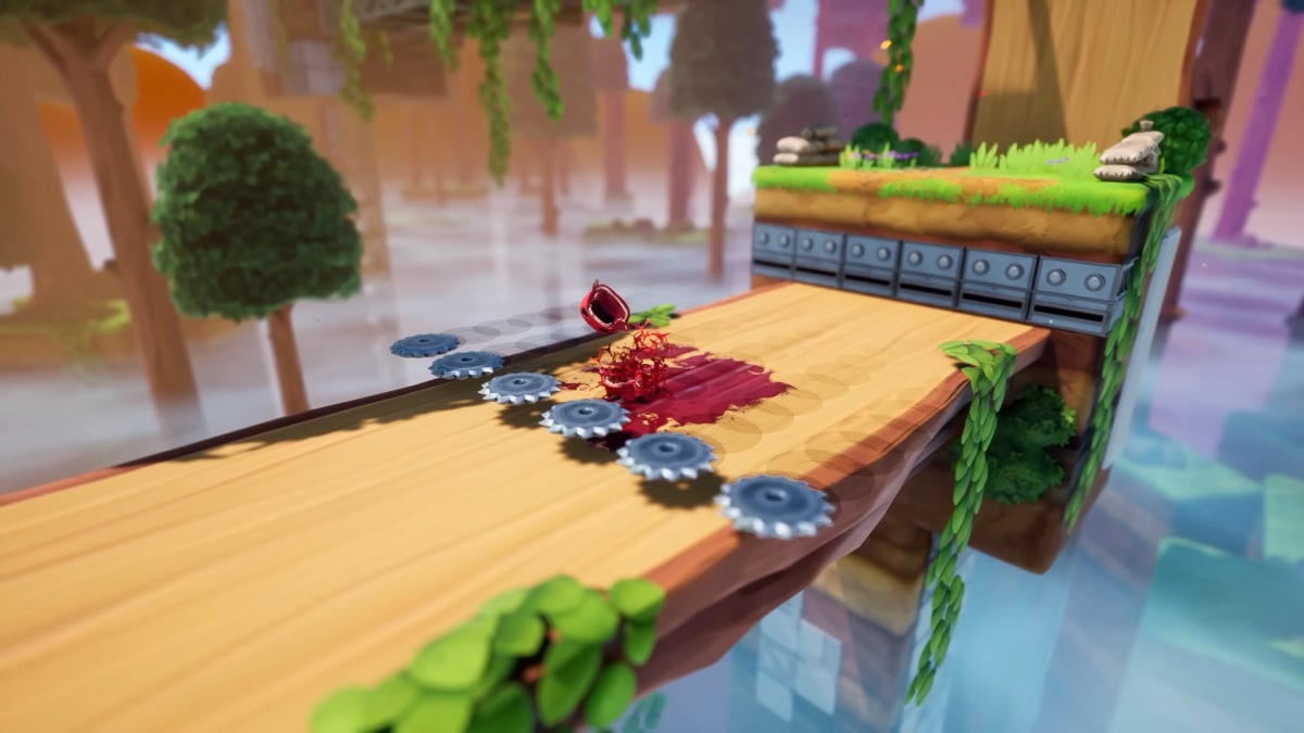 Meat Boy cut in have by saws in the air.