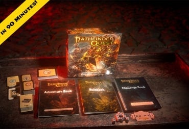 The game box of Pathfinder Quest, several softcover books, and decks of cards on a wooden desk. A chyron stating, "Funded in 90 Minutes" is visible on the upper left corner.