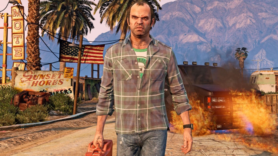 Trevor walking away from a burning car in Grand Theft Auto V, one of PlayStation's top-selling games of all time