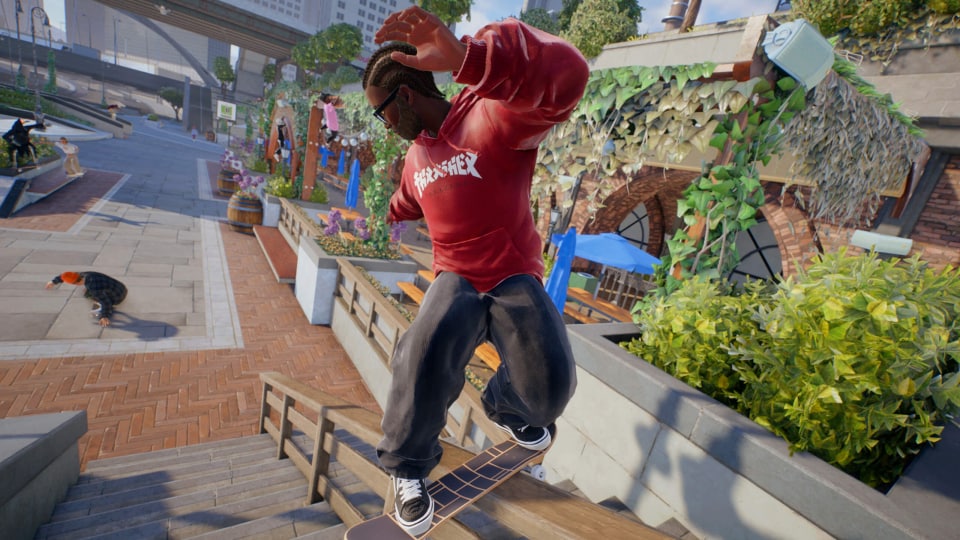 A skater in a Thrasher hoodie grinding a rail in EA's Skate reboot