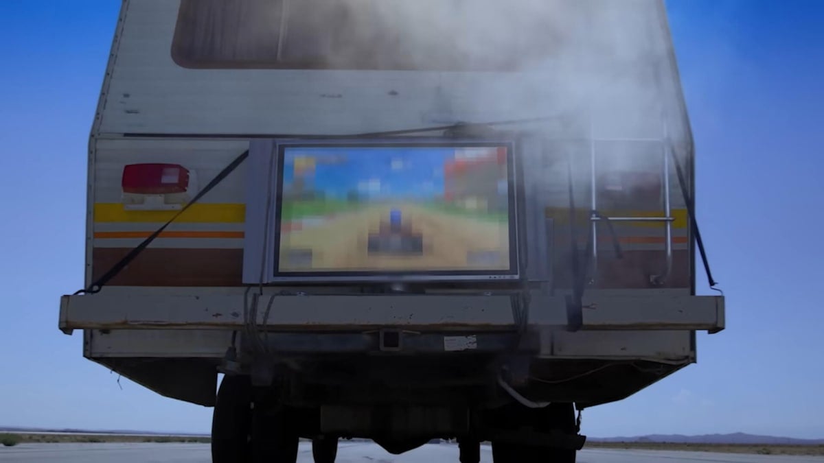 A TV showing a heavily pixelated Mario Kart World (probably) hitched to an RV in the new ad for Sonic Racing: CrossWorlds