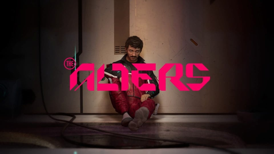 Jan Dolski sitting on the floor of the Womb with The Alters logo on top