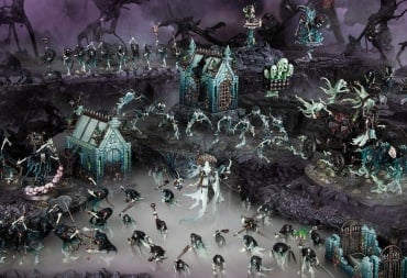 A table depicting an abandoned mausoleum with miniatures of skeletons and ghosts in front.