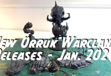 New Warhammer Orruk Warclans Releases arrayed on a green art mat