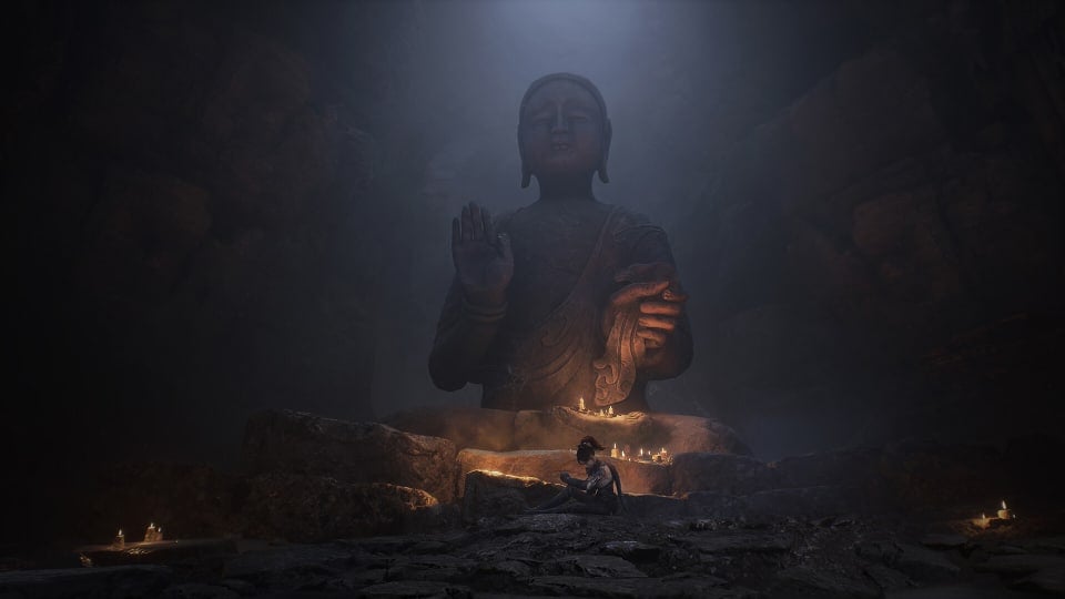 Protagonist Bai Wuchang sitting in front of a large statue.